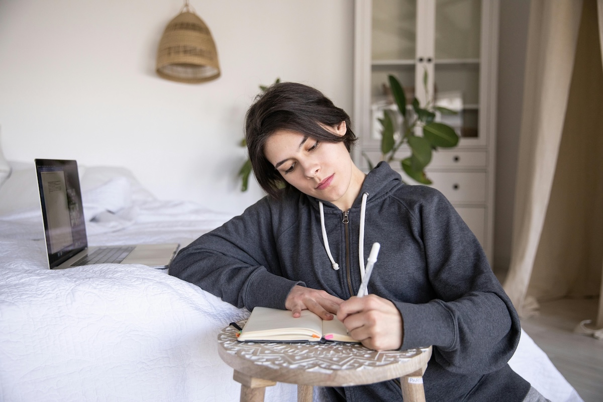 image of a woman doing therapeutic journaling in a private setting