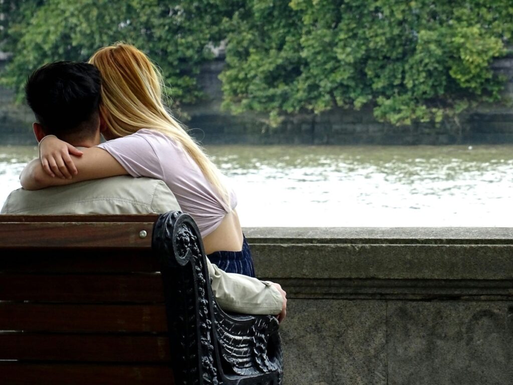 A couple's embrace, representing the first step towards healing and rebuilding a marriage after an affair disclosure.