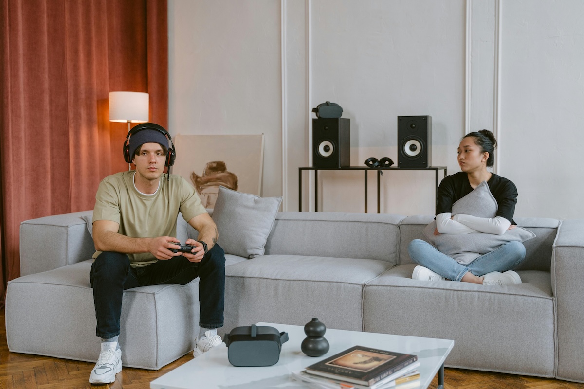 a couple with distance between them, symbolizing the emotional disconnection that comes from sex addiction