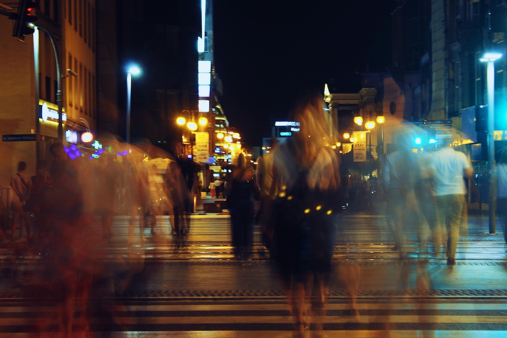 A soft-focus, artistic shot of a busy public street, emphasizing a neutral perspective of the surrounding environment.