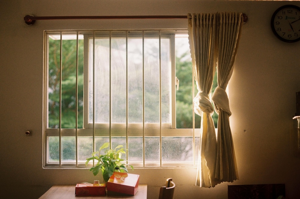 A bright, calm living room, reflecting the emotional safety gained through firm boundaries.