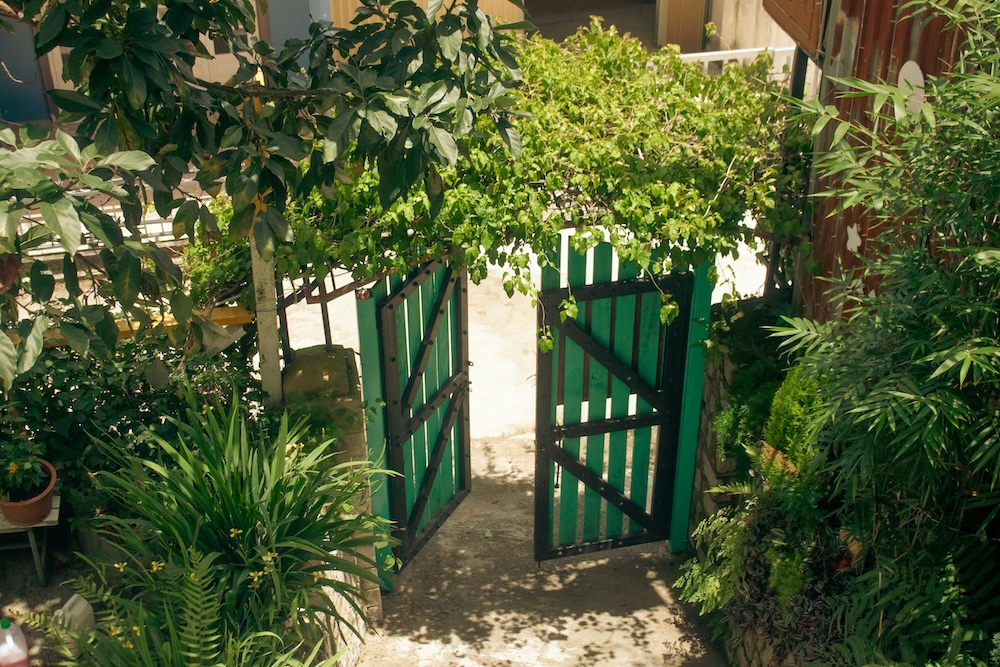 A beautiful garden gate left slightly ajar, symbolizing boundaries as the terms of engagement in a relationship.