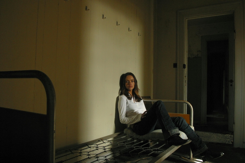 shame and pornography addiction in women — woman sitting with shame on face