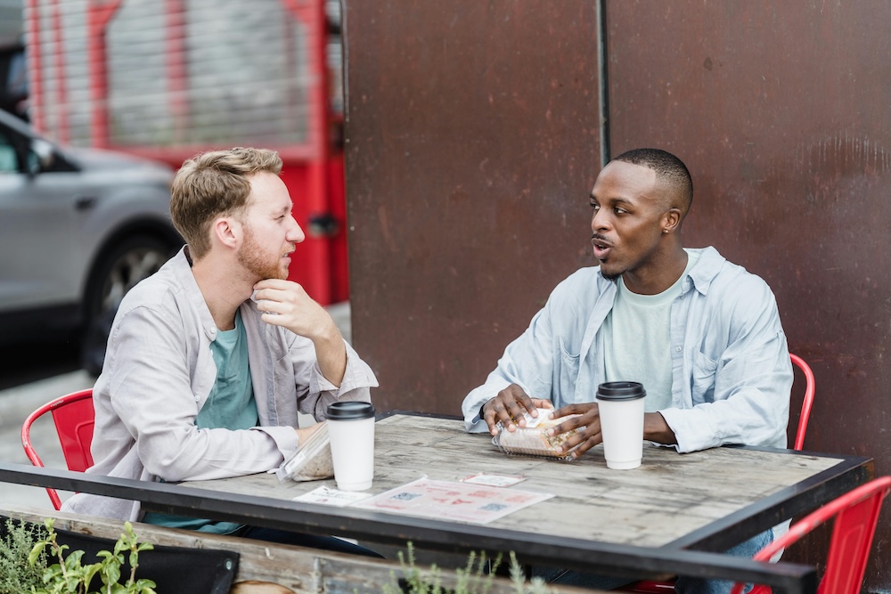 willpower and porn addiction -- two people in a quiet conversation, leaning in, listening intently